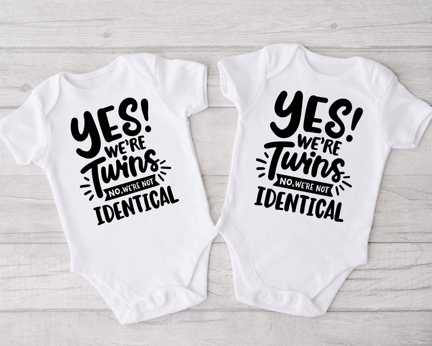 Yes We're Twins, No We're Not Identical Onesies®